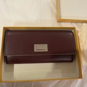 Brand new Fendi wallet dark egg plant in color